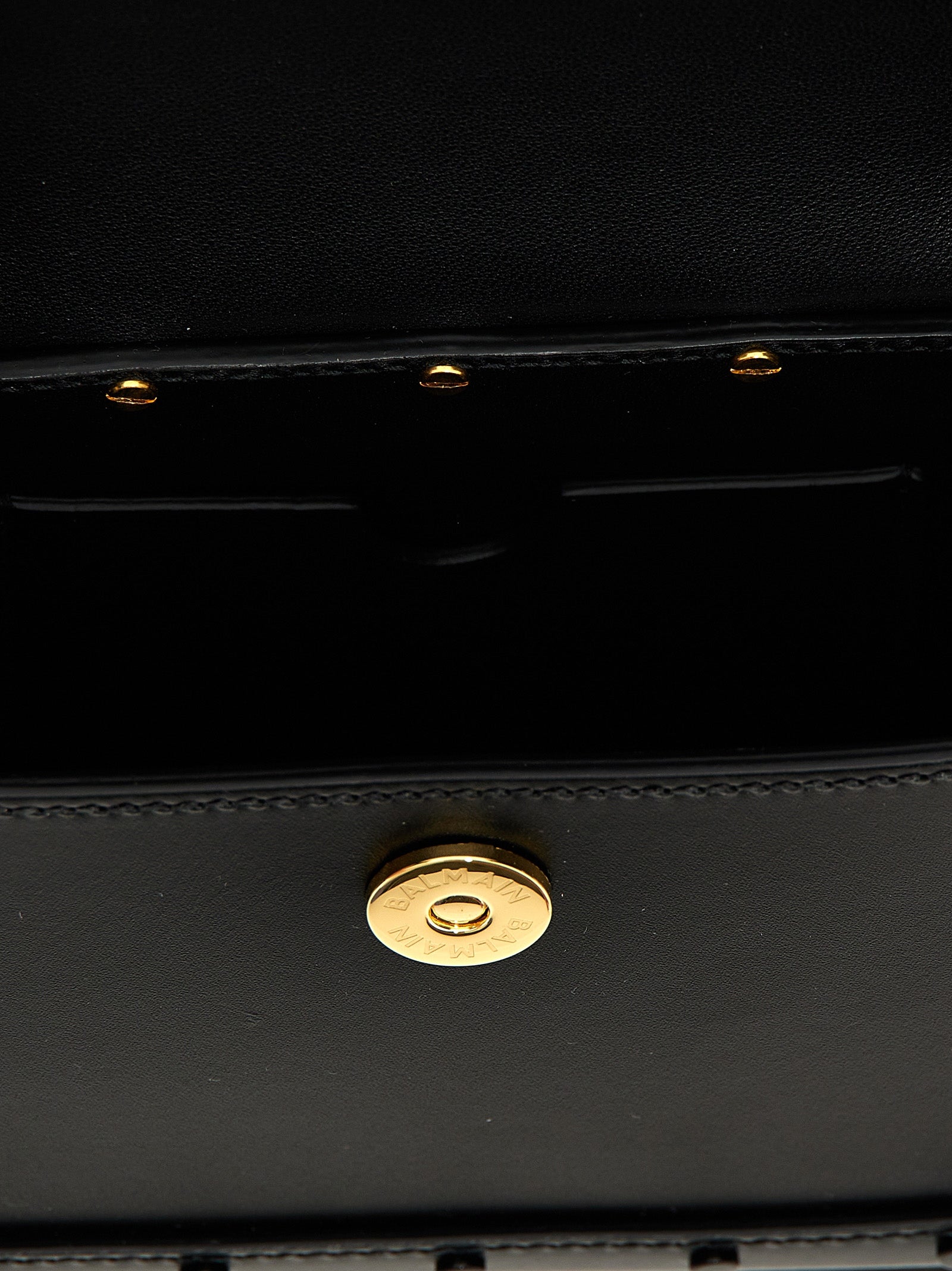 Shoulder Flap Handbag by Balmain for women in calfskin leather black features a contemporary silhouette, showcasing a secure flap & magnetic, ample , and contemporary shoulder-strap & handle for a sophisticated look.