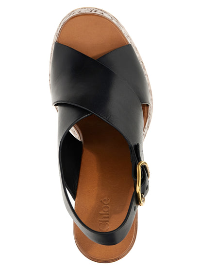 Platform Wedge Sandals by Chloé for women in cowhide leather black & natural showcases a sculptural silhouette as Women's Cowhide Leather Platform Wedge Sandals, defined by a sculptural platform wedge and sculptural for a sculptural look.