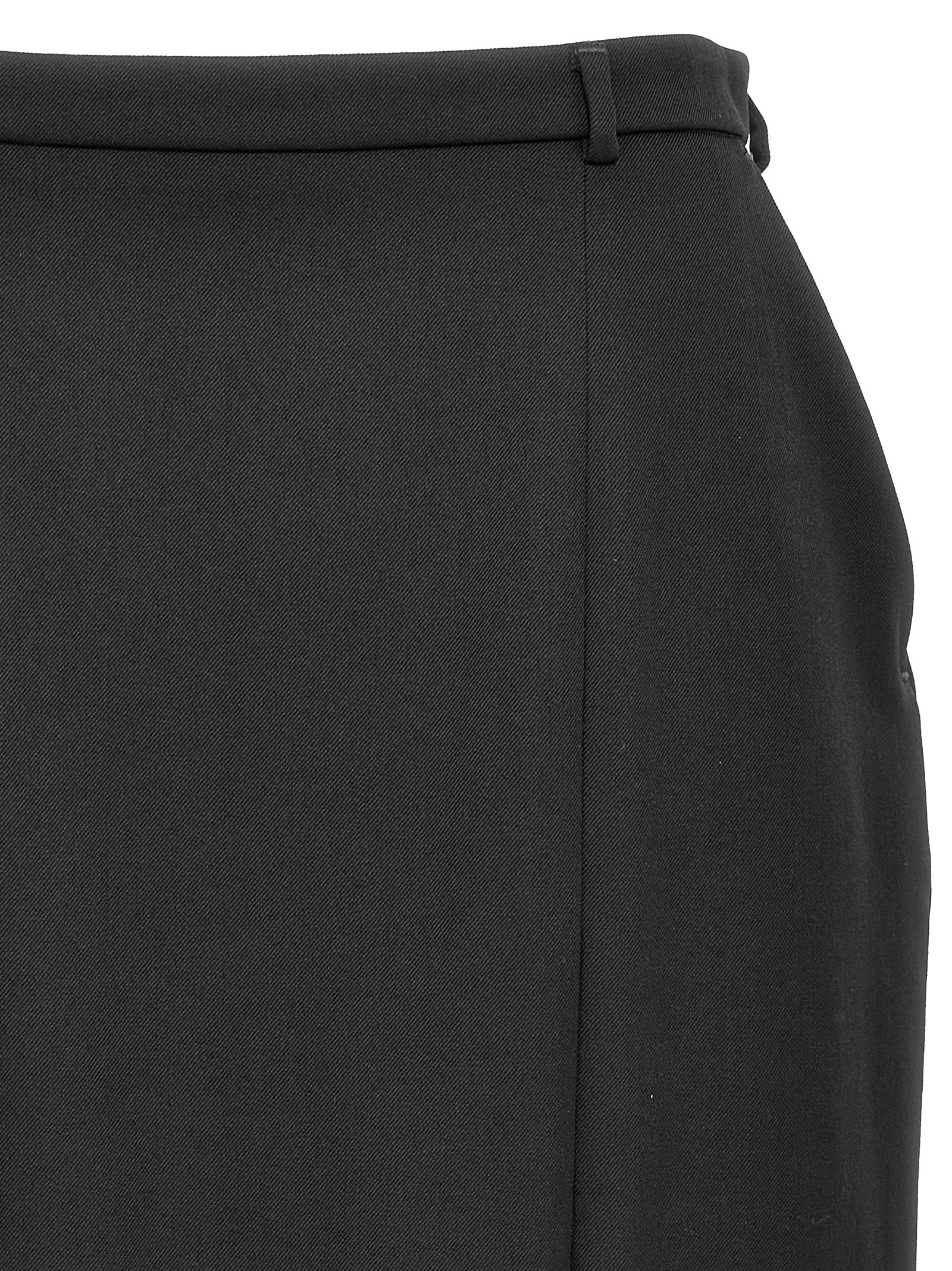 Skirt by Dolce & Gabbana for women in virgin wool black showcases a sultry silhouette, elegantly defined by its midi and the sophisticated sultry design of the Women's Virgin Wool Skirt.