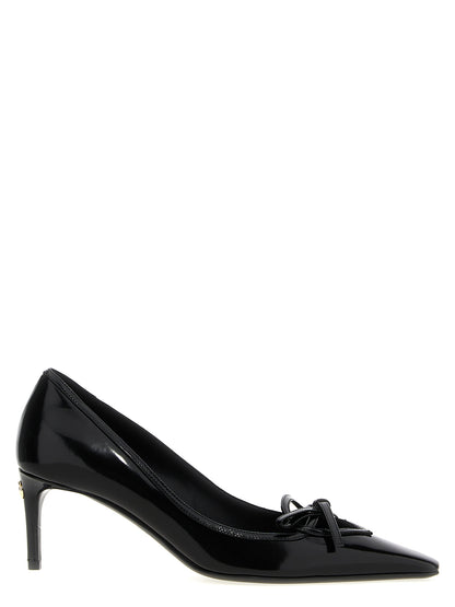 Mid-Heel Pumps Heels by Dolce & Gabbana for women in calfskin leather black features an effortlessly chic silhouette from the Women's Calfskin Leather Mid-Heel Pumps Heels collection, showcasing a mid-heel and effortlessly chic for a effortlessly chic look.