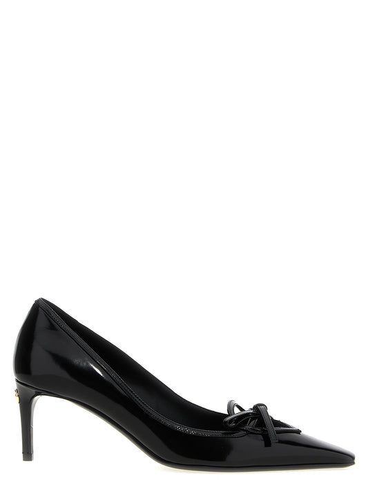 Mid-Heel Pumps Heels by Dolce & Gabbana for women in calfskin leather black features an effortlessly chic silhouette from the Women's Calfskin Leather Mid-Heel Pumps Heels collection, showcasing a mid-heel and effortlessly chic for a effortlessly chic look.
