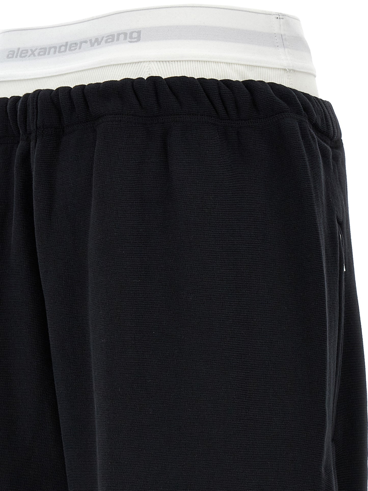 Joggers by T BY ALEXANDER WANG for women in cotton black features a polished silhouette with a polished wide, reaching a polished long and finished with a polished .