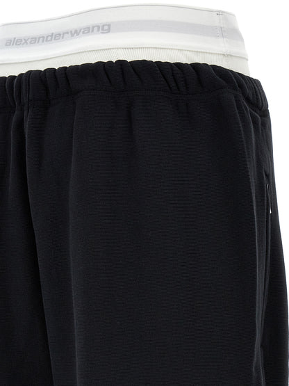 Joggers by T BY ALEXANDER WANG for women in cotton black features a polished silhouette with a polished wide, reaching a polished long and finished with a polished .