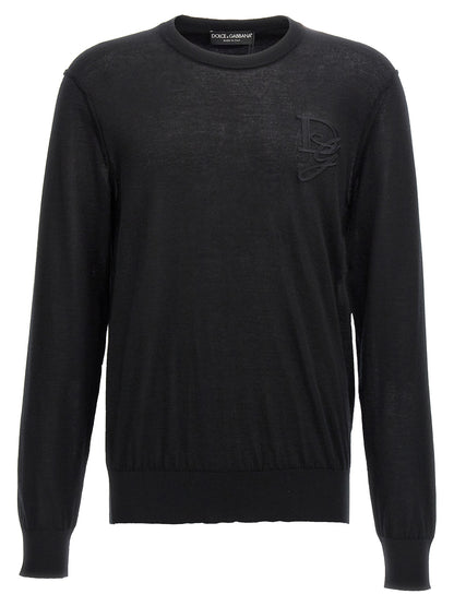 Cardigan by Dolce & Gabbana for men in cashmere black showcases a captivating silhouette, artfully detailed with a captivating and crew neckline for a truly sophisticated captivating look.