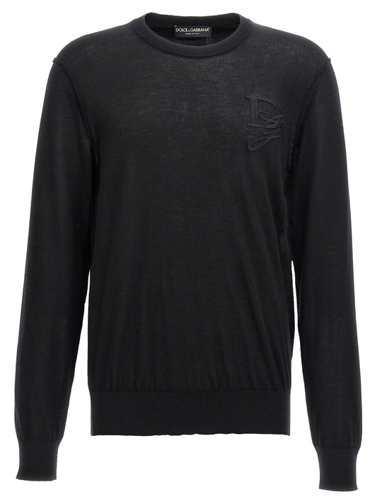 Cardigan by Dolce & Gabbana for men in cashmere black showcases a captivating silhouette, artfully detailed with a captivating and crew neckline for a truly sophisticated captivating look.