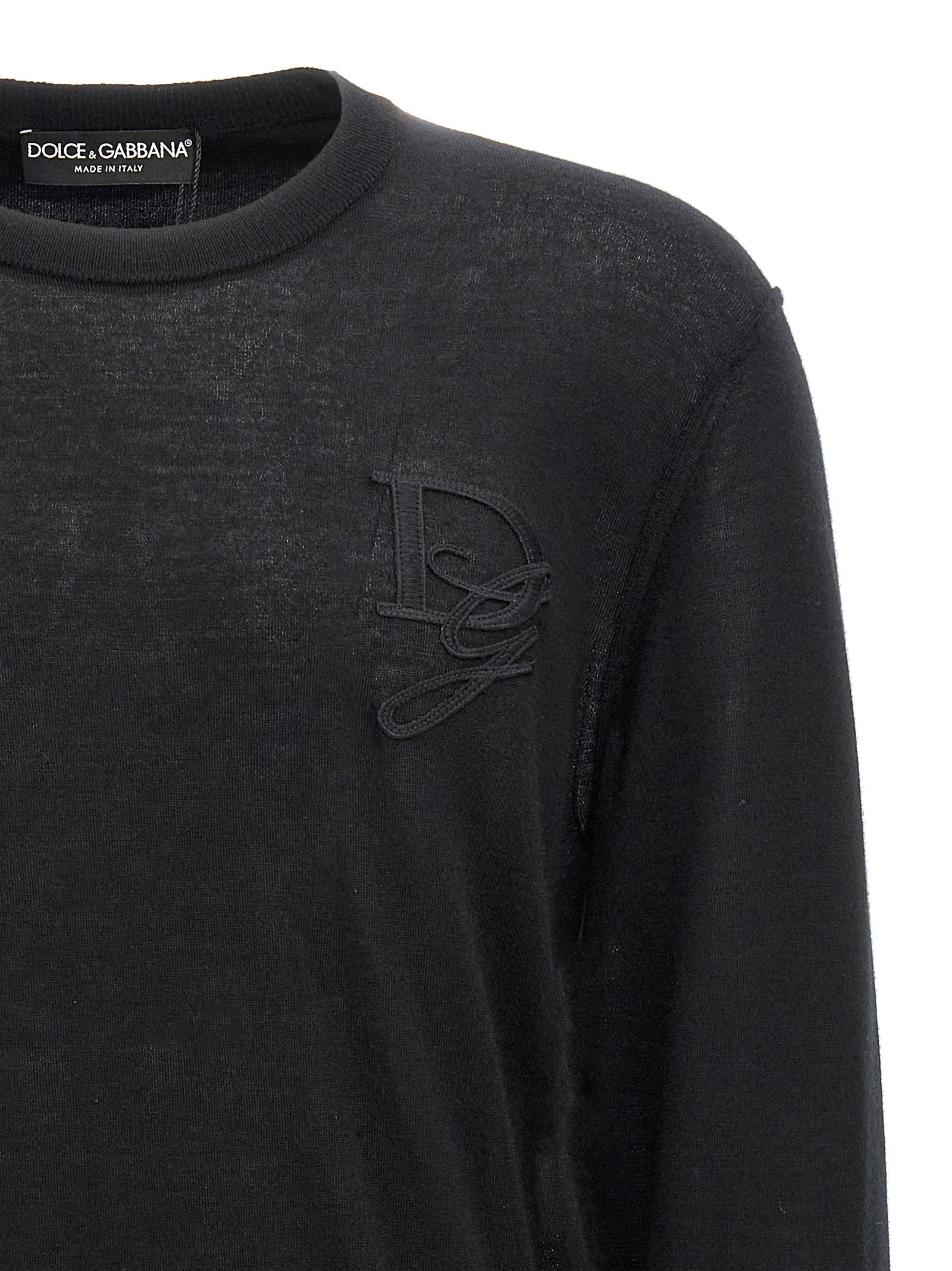 Cardigan by Dolce & Gabbana for men in cashmere black presents a textural silhouette, artfully finished with a textural crew neckline and for a sophisticated, textural look.