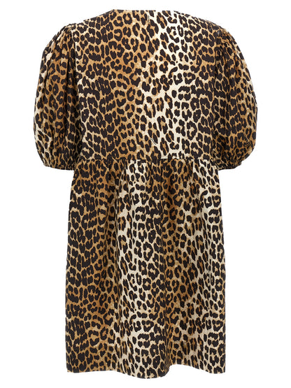 Dress by Ganni for women in organic cotton multicolor, leopard-print & print features a dramatic silhouette, showcasing an elegant crew neckline and that flows into a dramatic short.