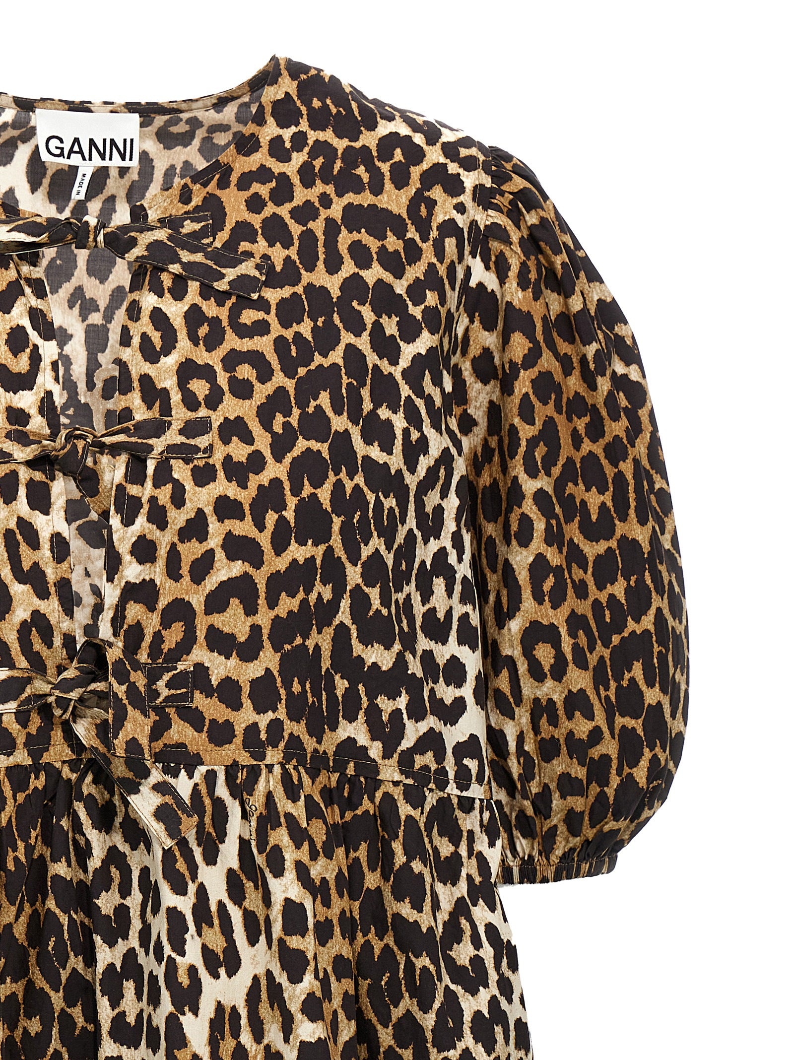 Dress by Ganni for women in organic cotton multicolor, leopard-print & print features an sultry silhouette defined by a crew neckline and , falling to an sultry short for a sultry look.