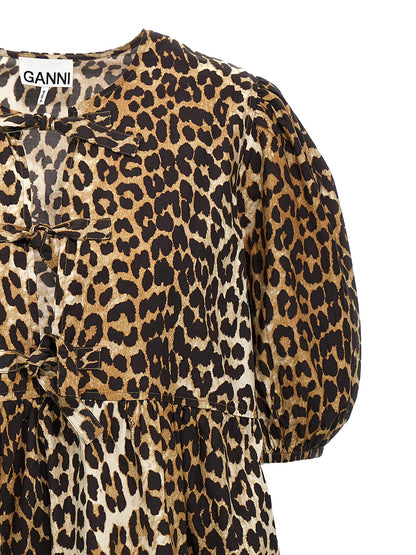 Dress by Ganni for women in organic cotton multicolor, leopard-print & print features an sultry silhouette defined by a crew neckline and , falling to an sultry short for a sultry look.