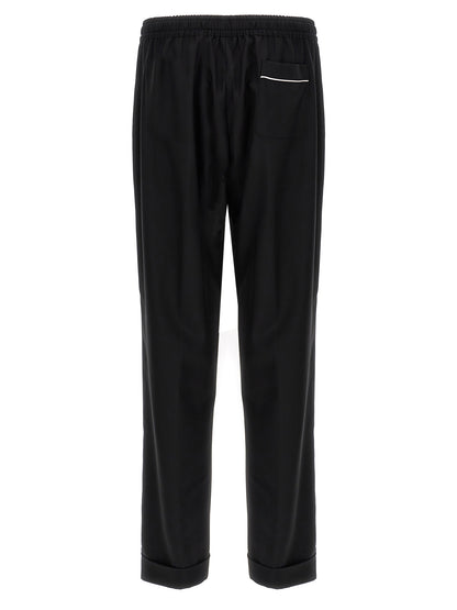 Casual Pants by Dolce & Gabbana for men in virgin wool black features a polished silhouette with a polished , reaching a polished long and finished with a polished .