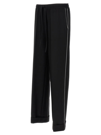Casual Pants by Dolce & Gabbana for men in virgin wool black presents a refined pantology silhouette, artfully defined by a refined pantology , long, and a sophisticated .