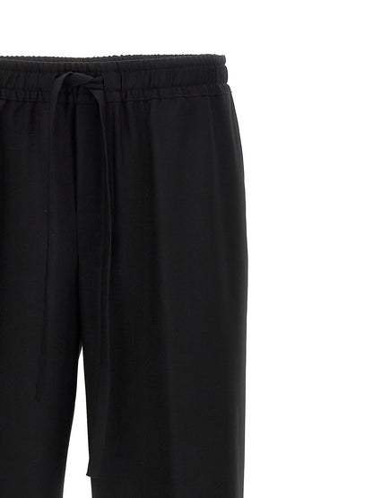 Casual Pants by Dolce & Gabbana for men in virgin wool black features an sartorial and long with a cut for a sartorial finish.