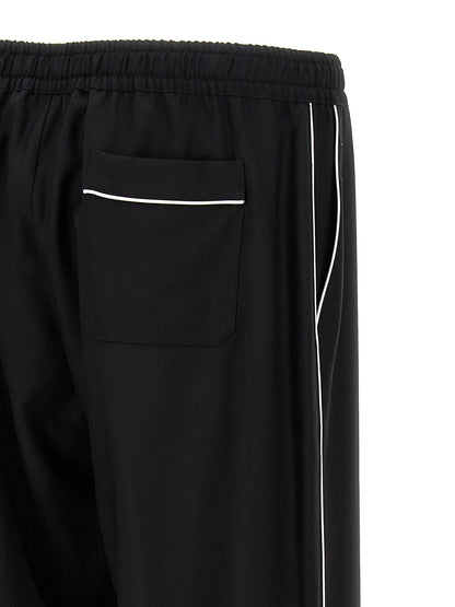 Casual Pants by Dolce & Gabbana for men in virgin wool black features a refined silhouette with a refined , defined by a and a refined long for a refined finish.