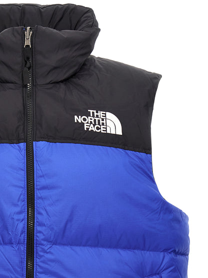 Hooded Vest by The North Face for men in plush nylon blue & signature showcases a dynamic silhouette, perfectly balancing pockets & hooded with a dynamic hooded neckline for a sophisticated, high-fashion look.