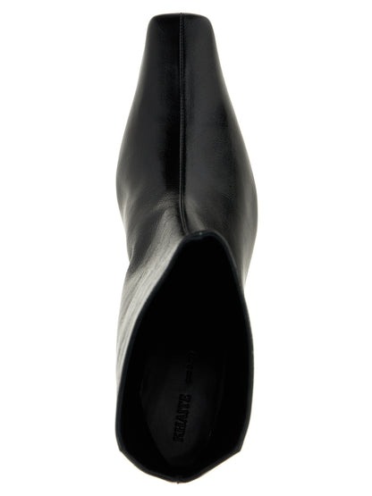 Ankle Boots by Khaite for women in calfskin leather black features an high-performance silhouette, showcasing the sophisticated design of the Women's Calfskin Leather Ankle Boots with a and a refined square toe style.
