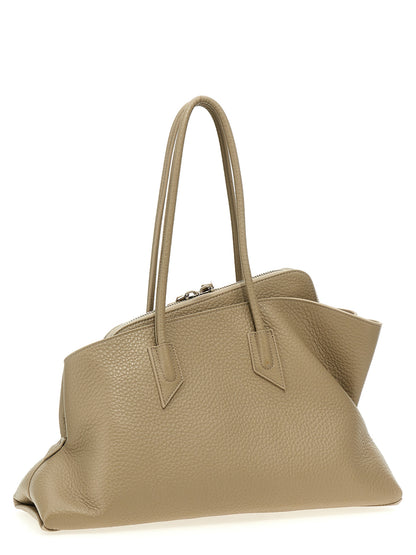 Medium Shoulder Bag by The Attico for women in calfskin leather beige & signature features a distinguished silhouette, showcasing a secure zipper and distinguished external-pockets with versatile shoulder-strap & handle for a distinguished finish.