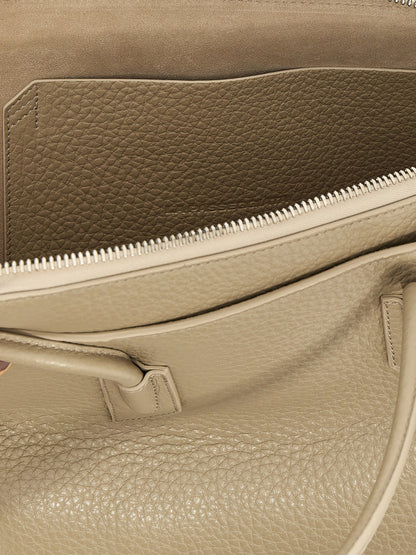 Medium Shoulder Bag by The Attico for women in calfskin leather beige & signature features a distinguished silhouette, showcasing a secure zipper and distinguished external-pockets with versatile shoulder-strap & handle for a distinguished finish.