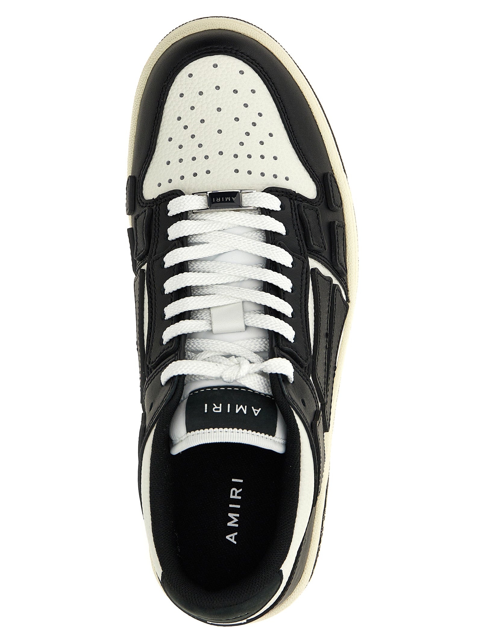 Sneakers by Amiri for men in bos taurus cowhide leather bicolour, black & white presents a sumptuous silhouette, artfully capturing the essence of the Men's Low Top Bos Taurus Cowhide Leather Sneakers with its sumptuous low-top style design.