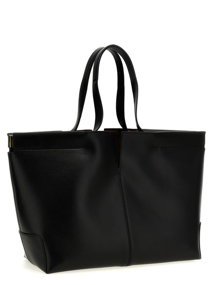 Shopper Tote Clutch Bag by Tod's for women in suede calfskin leather black features a distinguished Di Bag Folio Suede Calfskin Leather Shopper Tote Clutch design, complete with a secure zipper, ample , and versatile handle for a distinguished look.