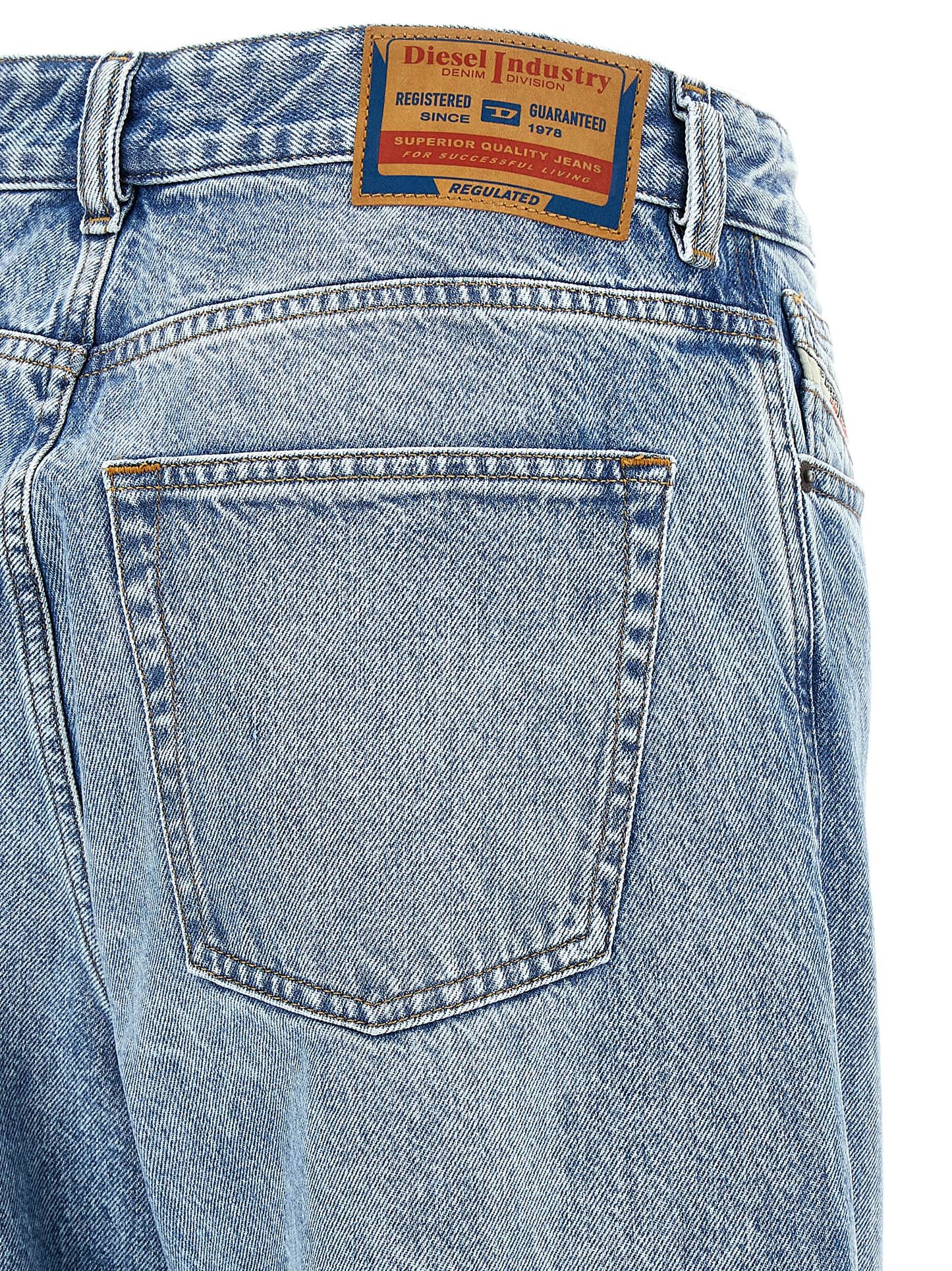 Jeans by Diesel for women in denim cotton blue presents a refined pantology silhouette, artfully defined by a refined pantology relaxed-fit & wide, long, and a sophisticated low rise.