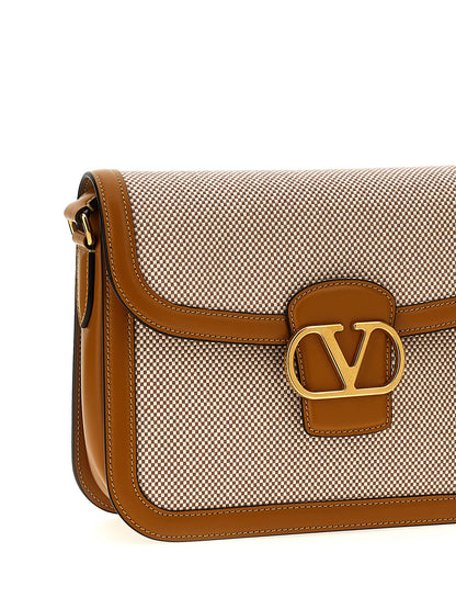 Shoulder Flap Bag by Valentino Garavani for women in cotton polyester canvas multicolor & signature showcases a statuesque silhouette, artfully detailed with a secure flap & magnetic, organized , and versatile shoulder-strap & adjustable-strap for a statuesque look.