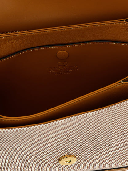 Shoulder Flap Bag by Valentino Garavani for women in cotton polyester canvas multicolor & signature features an effortlessly chic silhouette with a secure flap & magnetic, ample , and versatile shoulder-strap & adjustable-strap for effortlessly chic everyday luxury.