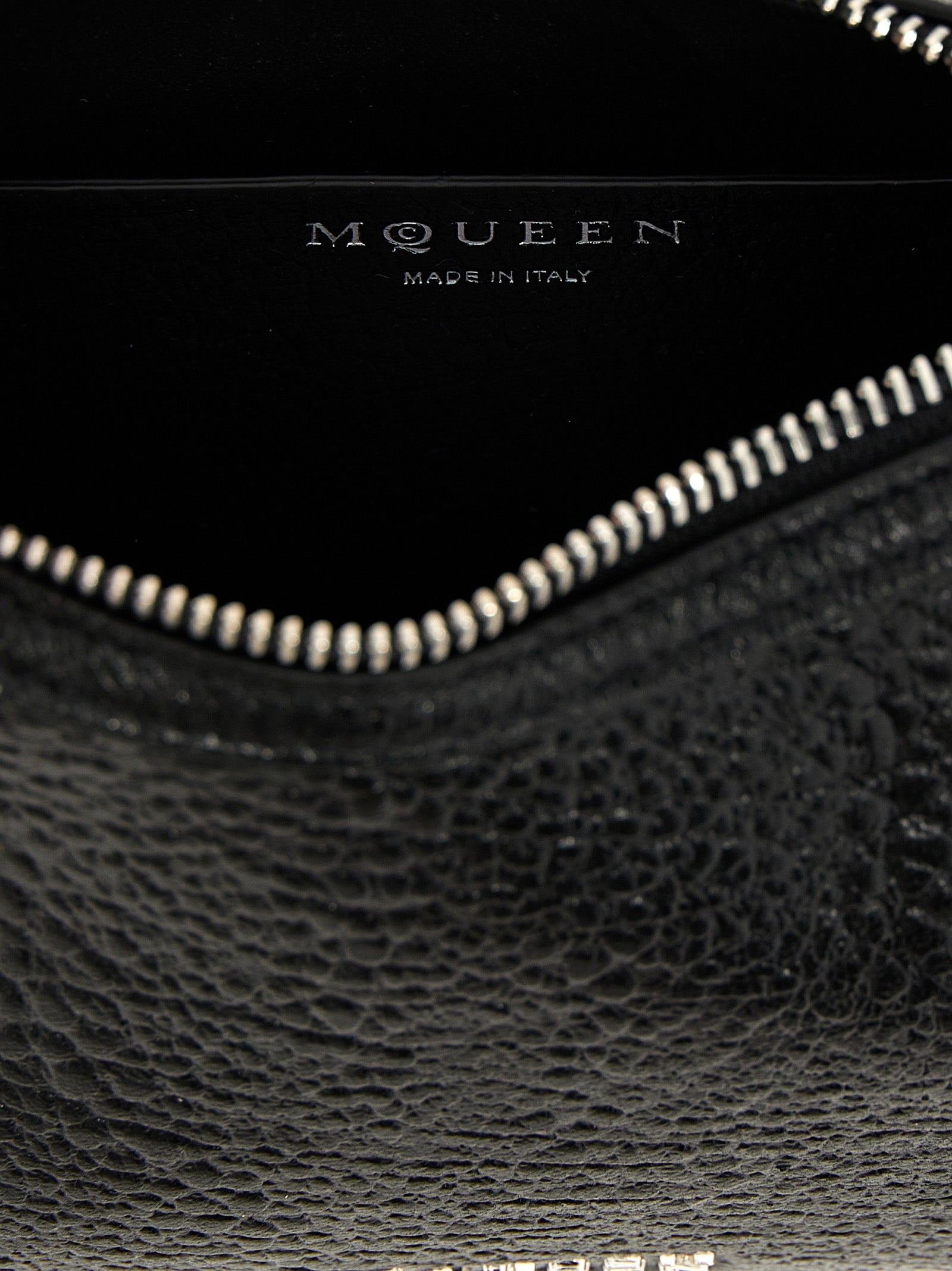 Mini Handbag by Alexander McQueen for women in lamb leather black features a ornamental silhouette, showcasing a secure zipper & hook, ample , and ornamental handle for a sophisticated look.