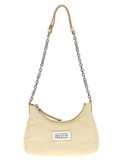 Micro Quilted Shoulder Hobo Bag by Maison Margiela for women in polyester white showcases a statuesque silhouette, artfully detailed with a secure zipper, organized , and versatile shoulder-strap & handle for a statuesque look.