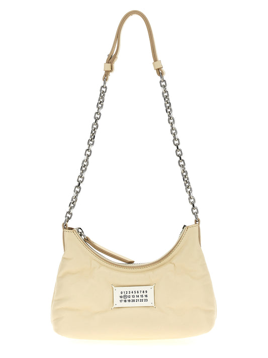 Micro Quilted Shoulder Hobo Bag by Maison Margiela for women in polyester white showcases a statuesque silhouette, artfully detailed with a secure zipper, organized , and versatile shoulder-strap & handle for a statuesque look.