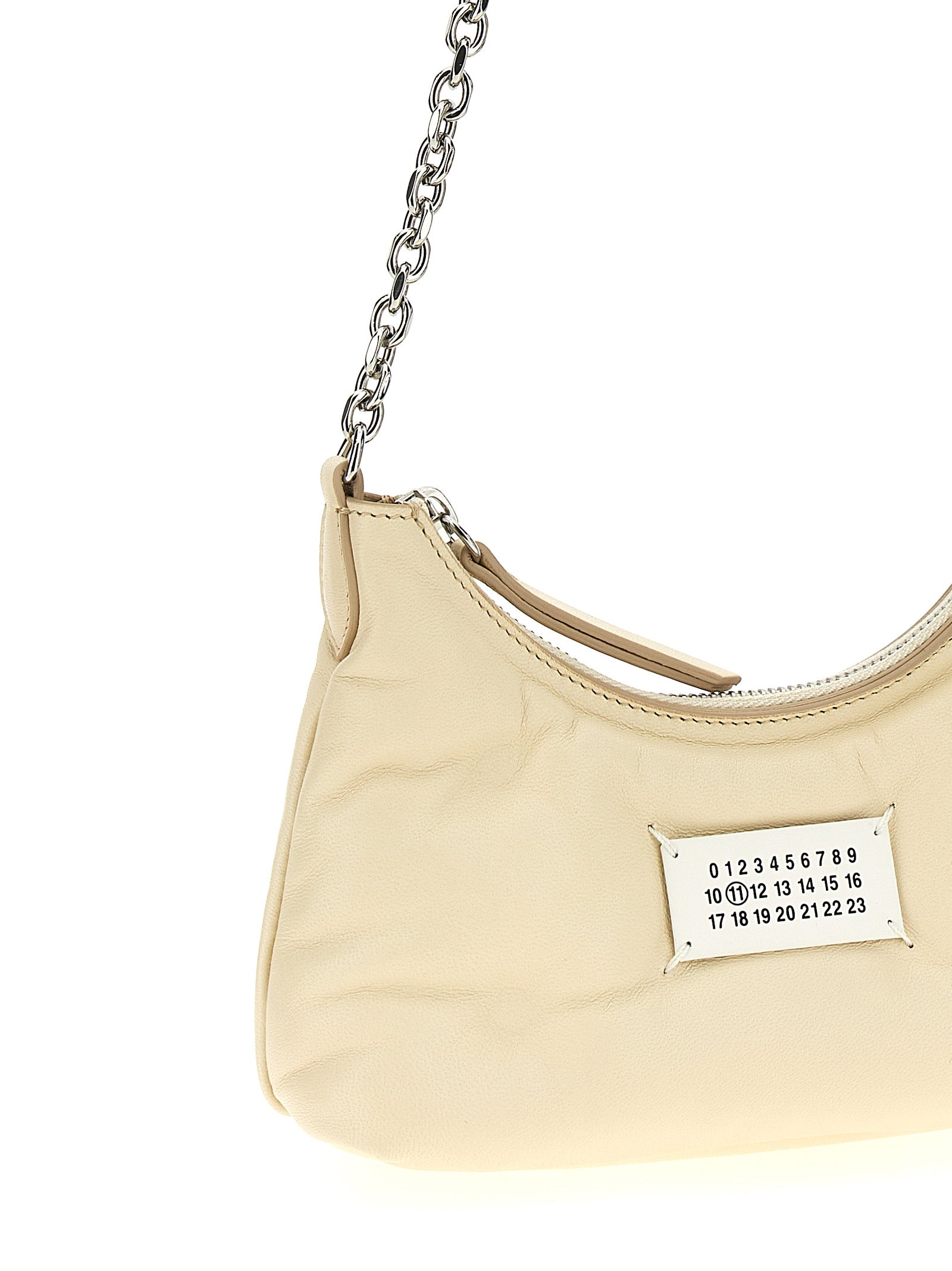 Micro Quilted Shoulder Hobo Bag by Maison Margiela for women in polyester white features a effortless chic silhouette with a secure zipper, ample , and versatile shoulder-strap & handle for a effortless chic finish.