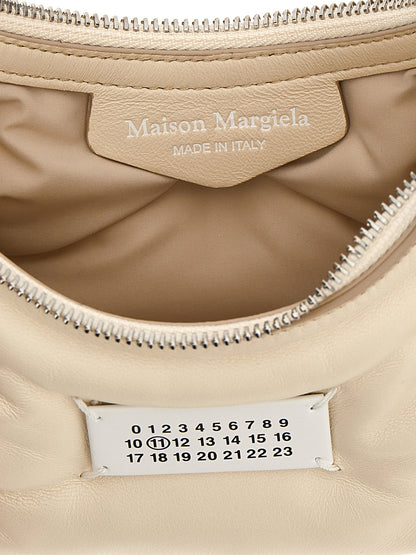 Micro Quilted Shoulder Hobo Bag by Maison Margiela for women in polyester white presents a statuesque silhouette, showcasing a secure zipper and statuesque with versatile shoulder-strap & handle for a sophisticated look.