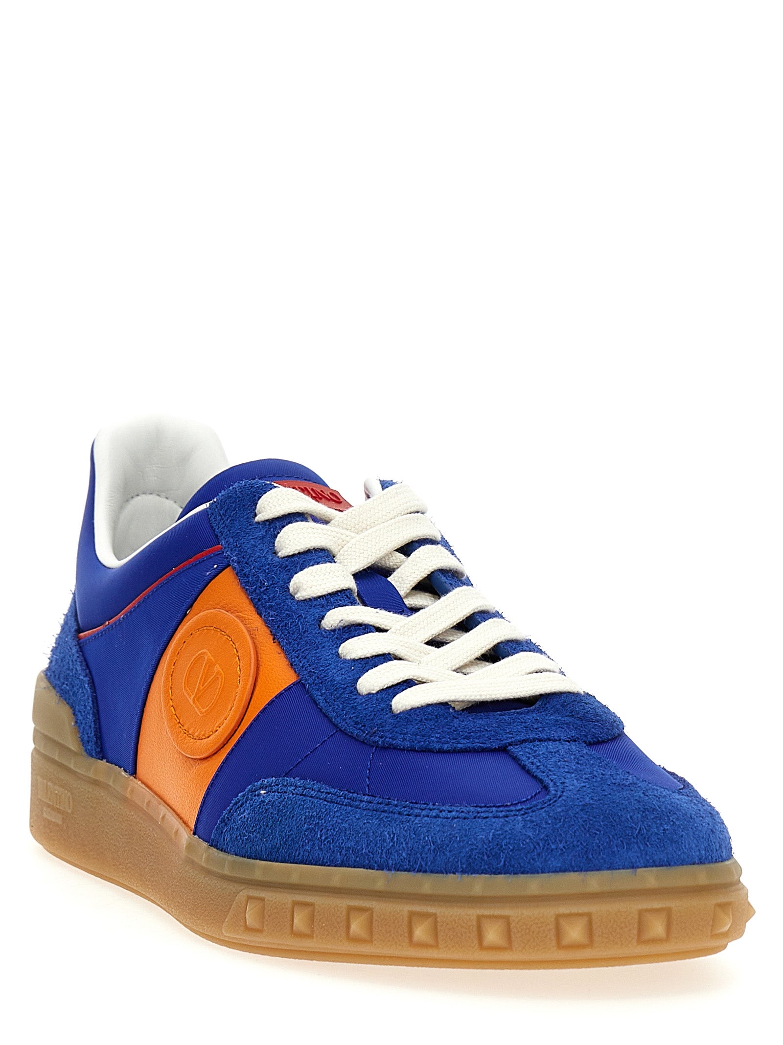 Sneakers by Valentino Garavani for men in bos taurus calfskin leather blue & signature presents a sumptuous silhouette, artfully capturing the essence of the V Logo Men's Low Top Bos Taurus Calfskin Leather Sneakers with its sumptuous low-top style design.