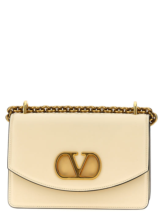 2-in-1 Shoulder & Crossbody Flap Bag by Valentino Garavani for women in calfskin leather white & signature features a effortless chic silhouette with a secure flap & magnetic, ample , and versatile crossbody-strap & shoulder-strap for a effortless chic finish.