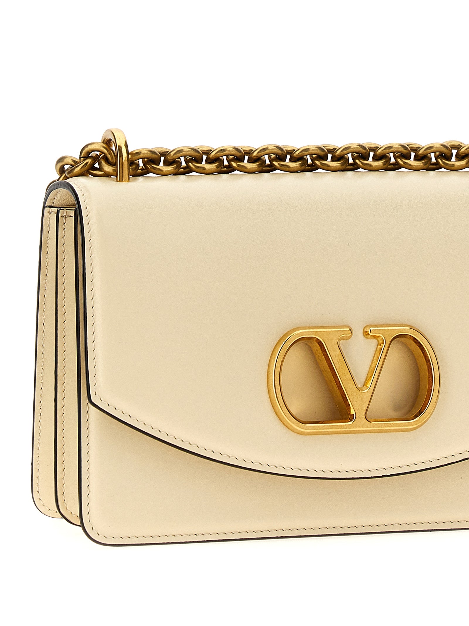 2-in-1 Shoulder & Crossbody Flap Bag by Valentino Garavani for women in calfskin leather white & signature features a distinguished silhouette, showcasing a secure flap & magnetic and distinguished with versatile crossbody-strap & shoulder-strap for a distinguished finish.