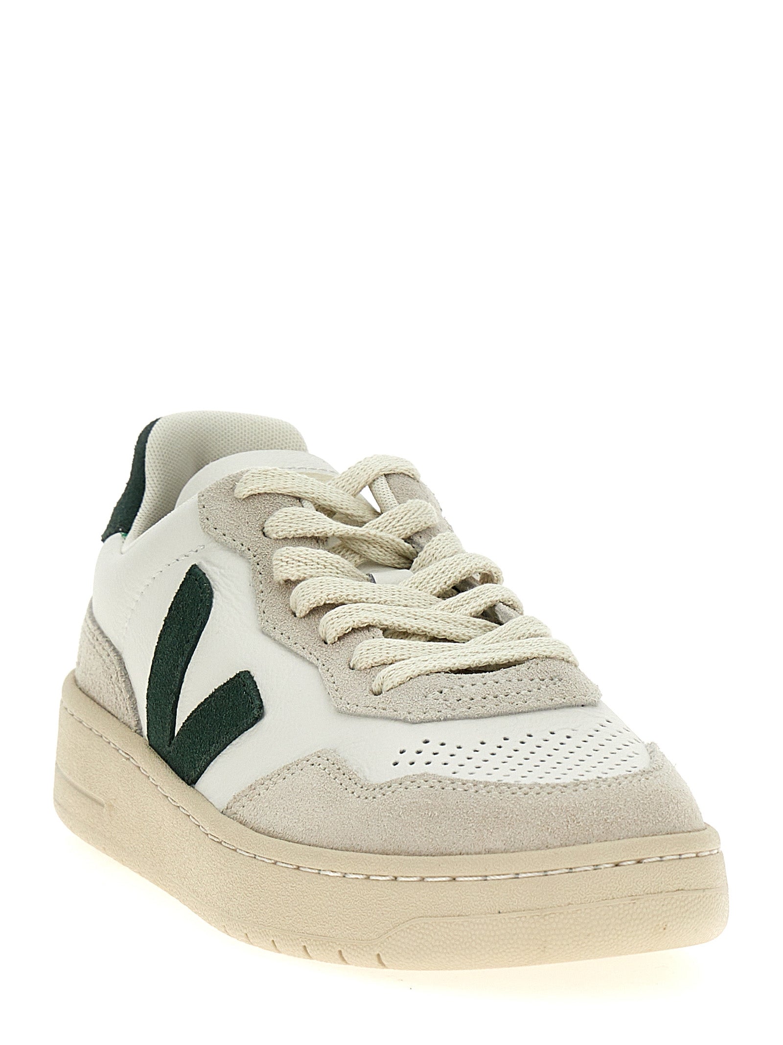 Sneakers by Veja for women in suede leather & rubber bicolour & green presents a sumptuous silhouette, artfully capturing the essence of the Women's Low Top Suede Leather & Rubber Sneakers with its sumptuous low-top style design.