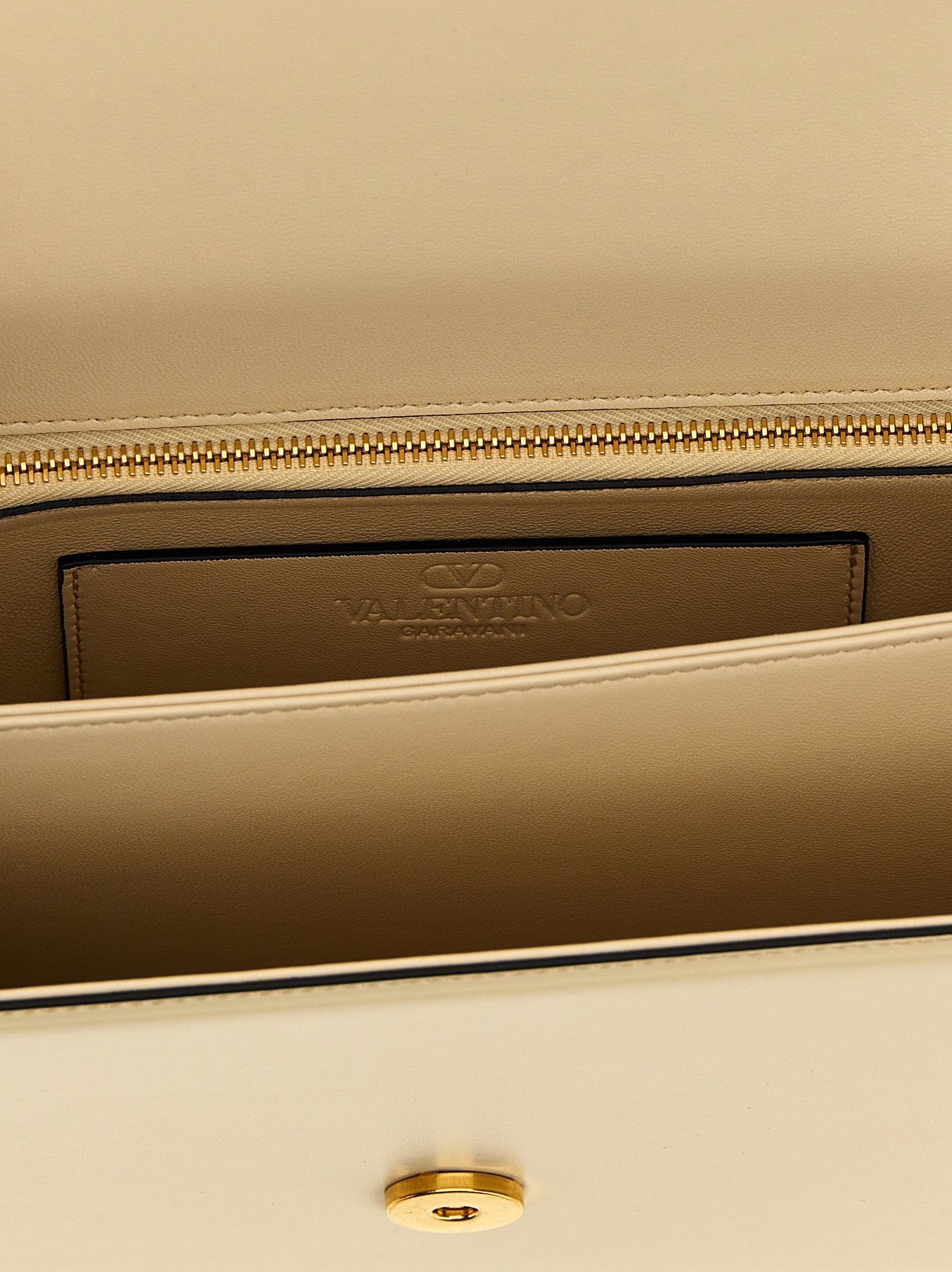 2-in-1 Shoulder & Crossbody Flap Bag by Valentino Garavani for women in bos taurus nappa & suede calf leather white & signature showcases a enviable silhouette, artfully detailed with a secure flap & magnetic, organized , and versatile crossbody-strap & shoulder-strap for a enviable look.