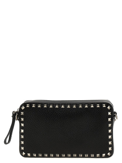 Crossbody Messenger Bag by Valentino Garavani for men in calfskin leather black features a artisanal Rockstud Calfskin Leather Crossbody Messenger Bag design with a secure zipper, ample , and versatile crossbody-strap, shoulder-strap & adjustable-strap for a artisanal finish.