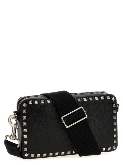 Crossbody Messenger Bag by Valentino Garavani for men in calfskin leather black presents a on trend Rockstud Calfskin Leather Crossbody Messenger Bag design, featuring a secure zipper, ample , and on trend crossbody-strap, shoulder-strap & adjustable-strap for a on trend finish.