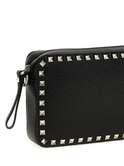 Crossbody Messenger Bag by Valentino Garavani for men in calfskin leather black features an fashionable Rockstud Calfskin Leather Crossbody Messenger Bag design with a fashionable zipper, ample , and versatile crossbody-strap, shoulder-strap & adjustable-strap for a sophisticated finish.