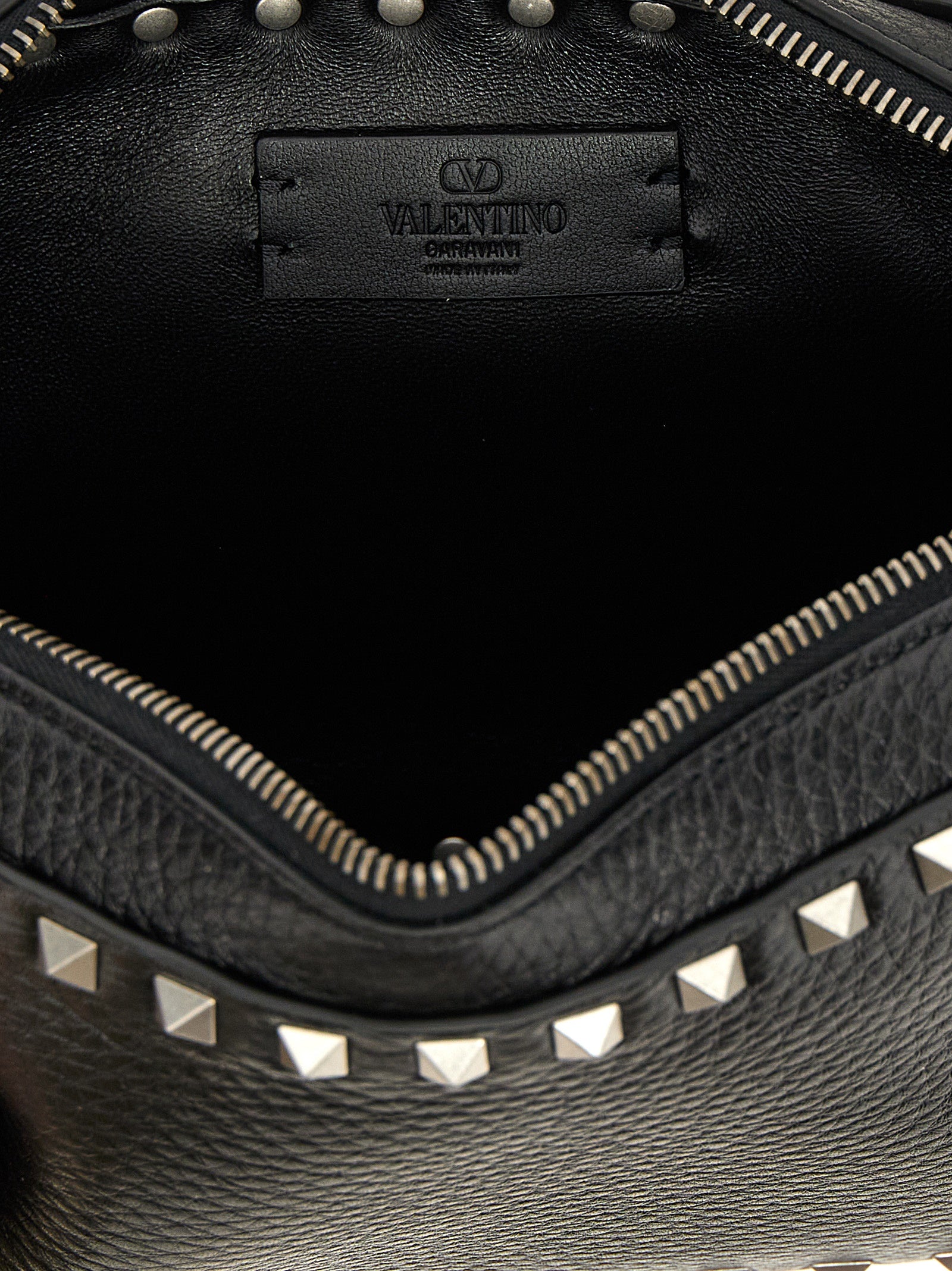 Crossbody Messenger Bag by Valentino Garavani for men in calfskin leather black features an fashionable Rockstud Calfskin Leather Crossbody Messenger Bag design with a fashionable zipper, ample , and versatile crossbody-strap, shoulder-strap & adjustable-strap for a sophisticated finish.