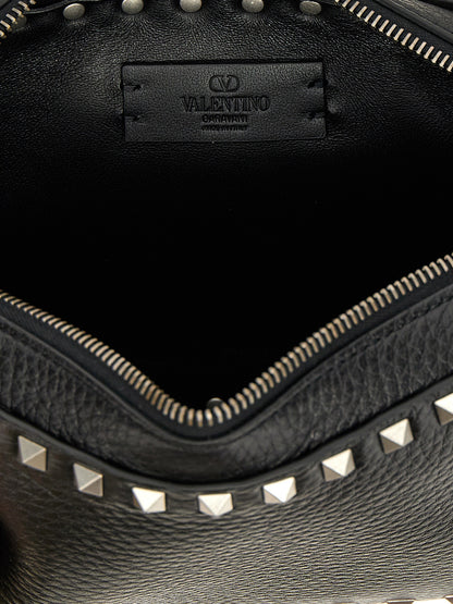 Crossbody Messenger Bag by Valentino Garavani for men in calfskin leather black features an fashionable Rockstud Calfskin Leather Crossbody Messenger Bag design with a fashionable zipper, ample , and versatile crossbody-strap, shoulder-strap & adjustable-strap for a sophisticated finish.