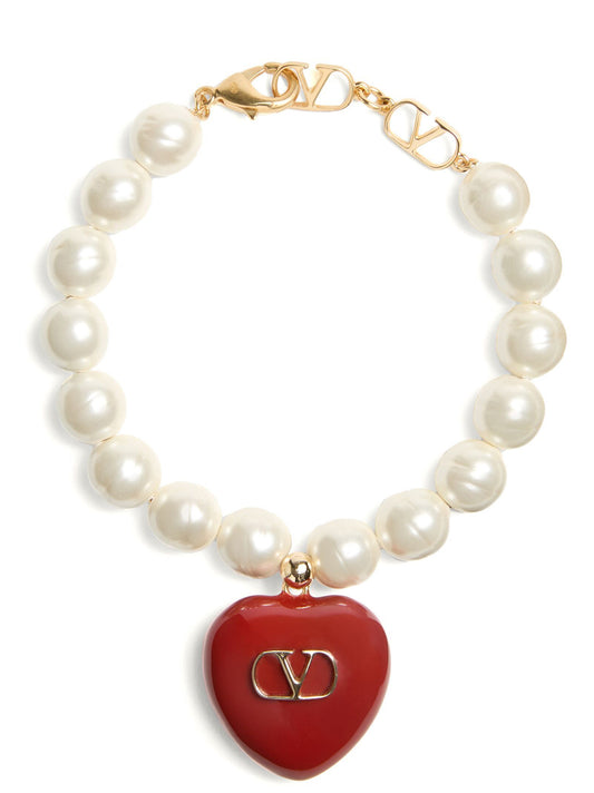 This Bracelet by Valentino Garavani for women in polyamide & goose-down and multicolor, red & signature showcases a exquisite silhouette, highlighting the intricate from the V Logo Women's Enamel Brass & Glass Bracelet collection for a exquisite aesthetic.