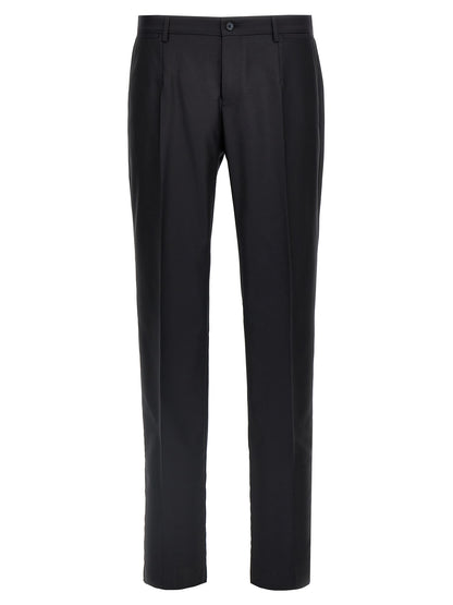 This Pant Suit by Dolce & Gabbana for men in silk canvas & virgin wool blue presents a discerning silhouette, featuring a sophisticated and a discerning straight-leg for a refined and polished look.