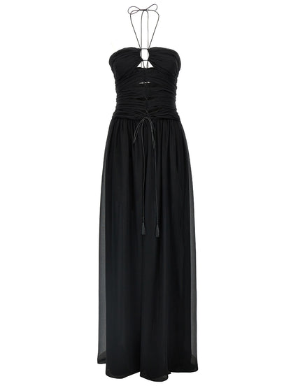 Dress by Tom Ford for women in silk black features a dramatic silhouette, showcasing an elegant and that flows into a dramatic maxi long.