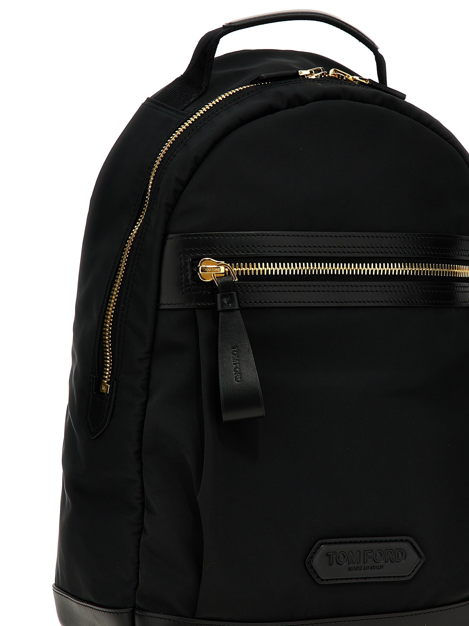 Travel Backpack by Tom Ford for men in calf leather & poly nylon black & signature features a utilitarian chic Calf Leather & Poly Nylon Travel Backpack design with a secure zipper, ample external-pockets, and versatile backpack-strap & adjustable-strap for a utilitarian chic finish.