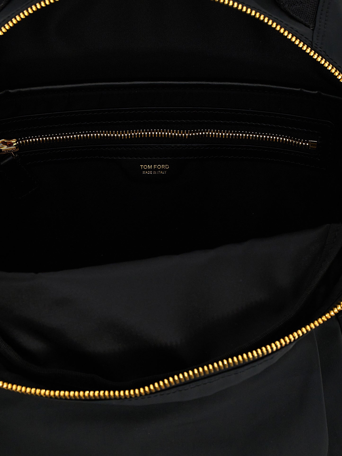 Travel Backpack by Tom Ford for men in calf leather & poly nylon black & signature features a utilitarian chic Calf Leather & Poly Nylon Travel Backpack design with a secure zipper, ample external-pockets, and versatile backpack-strap & adjustable-strap for a utilitarian chic finish.