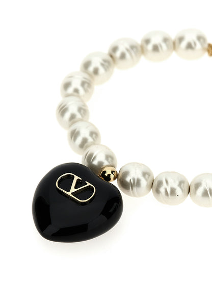 Bracelet by Valentino Garavani for women in calfskin leather black & signature showcases a cosmopolitan silhouette, artfully capturing the essence of the cosmopolitan V Logo Women's Enamel Brass & Glass Bracelet with a cosmopolitan .