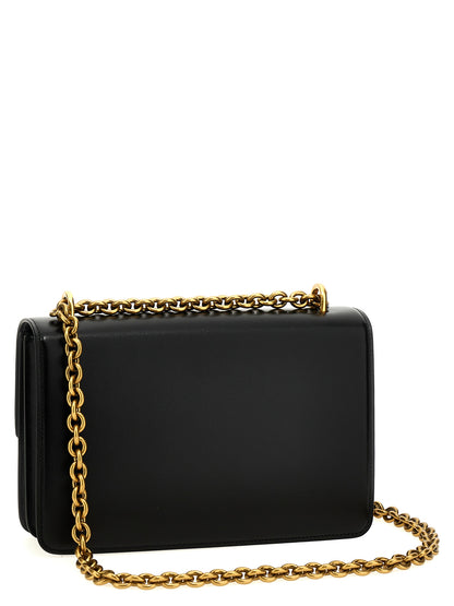 Shoulder Flap Bag by Valentino Garavani for women in calfskin leather black & signature showcases a enviable silhouette, artfully detailed with a secure flap & magnetic, organized , and versatile shoulder-strap for a enviable look.