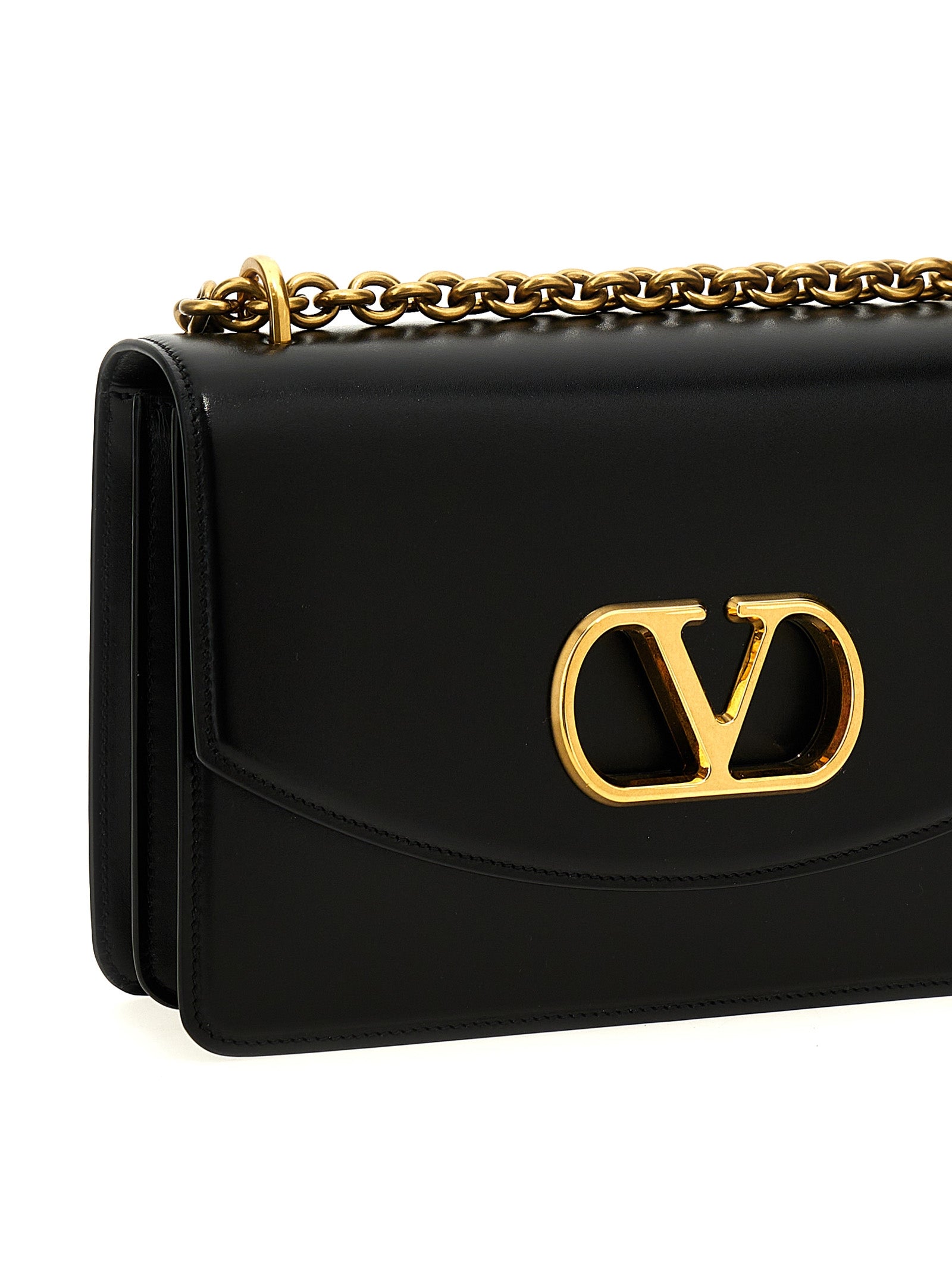 Shoulder Flap Bag by Valentino Garavani for women in calfskin leather black & signature features a effortless chic silhouette with a secure flap & magnetic, ample , and versatile shoulder-strap for a effortless chic finish.