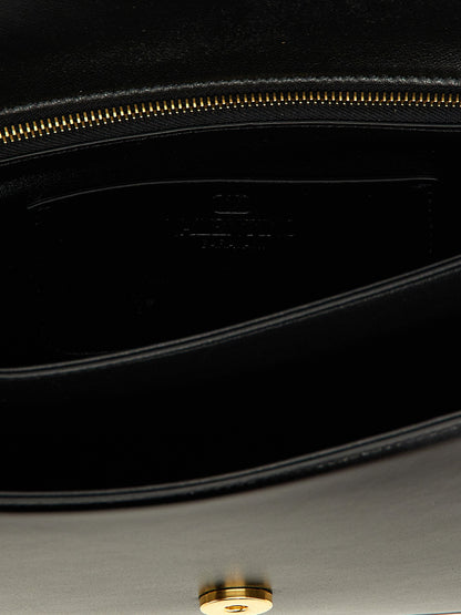Shoulder Flap Bag by Valentino Garavani for women in calfskin leather black & signature presents a versatile silhouette, showcasing a secure flap & magnetic and versatile with versatile shoulder-strap for a sophisticated look.